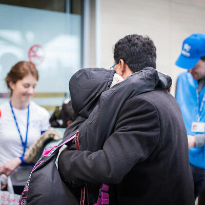 Refugee reuniting with his family at airport in Montenegro