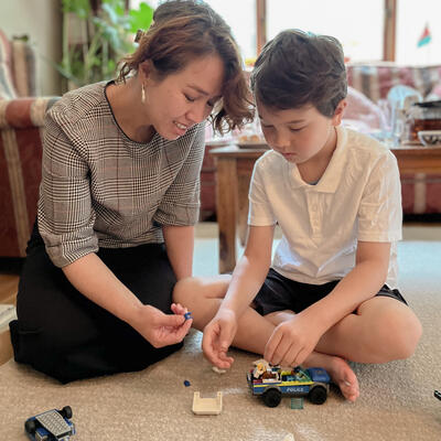 Mother and son playing at their house