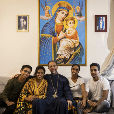 Family members posing for a photo at home