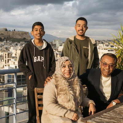 Rphingya refugee family posing for a photo in Greece