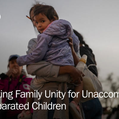 Cover photo of a factsheet depicting a woman holding a child in a displacement setting