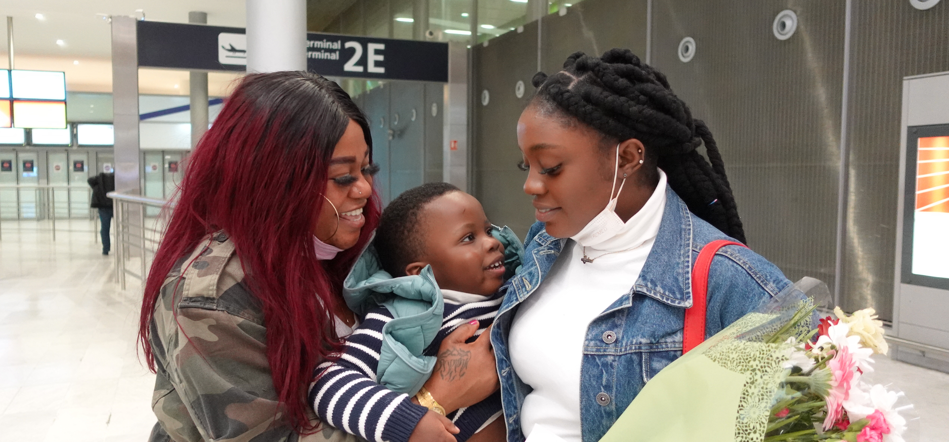 Mother and daughter reuniting at airport