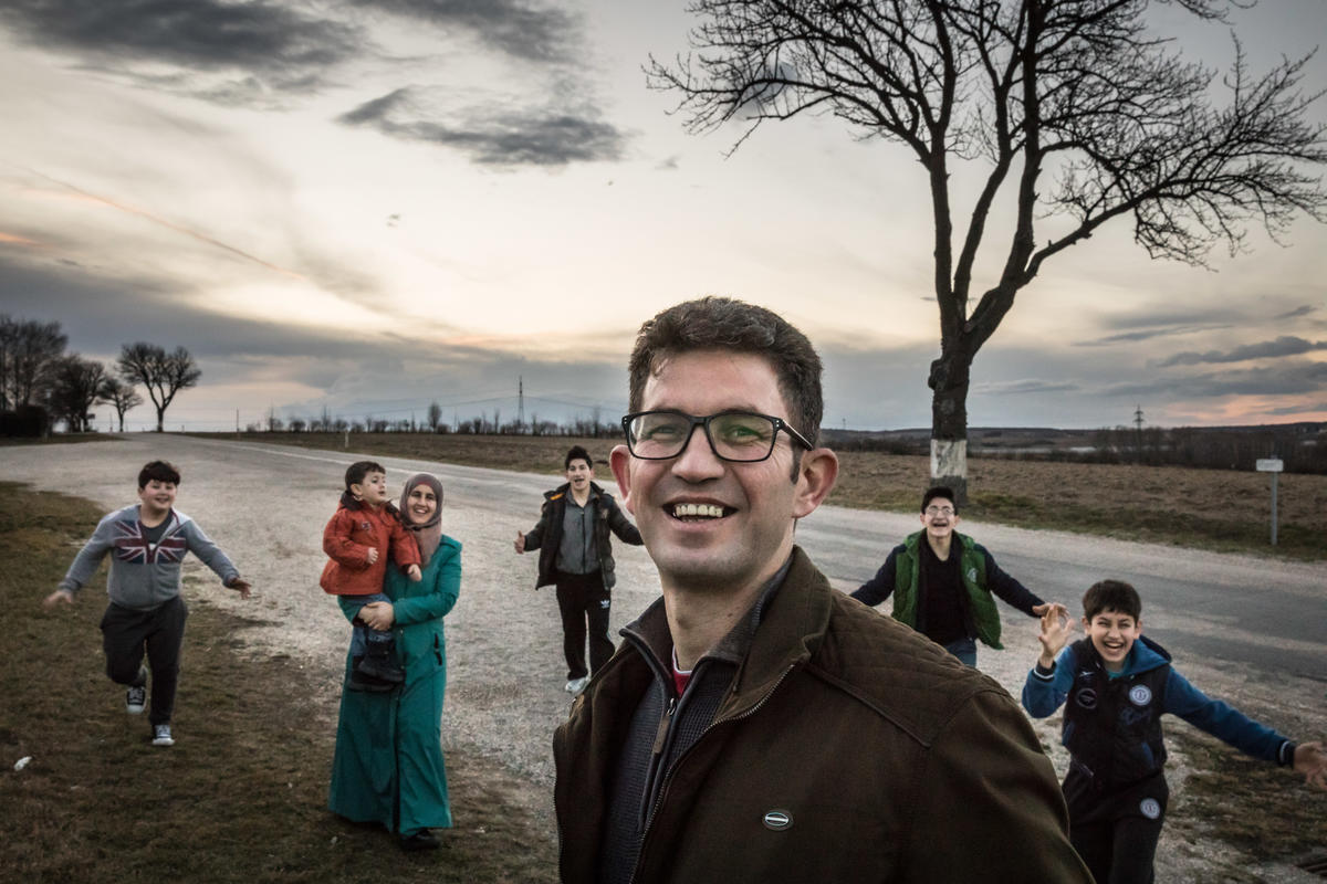 Syrian refugee, Ahmad, and his wife have found a safe haven in an Austrian village raising not only their own sons and nephews. Syrian family posing together in an Austrian village