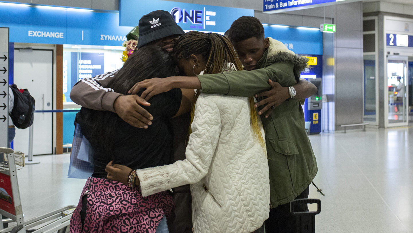 Refugee family hugging