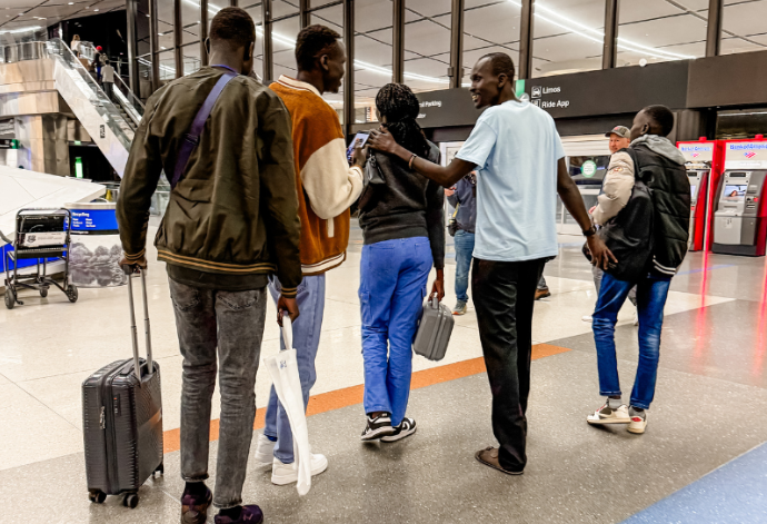 A family of refugees reuniting at the airport