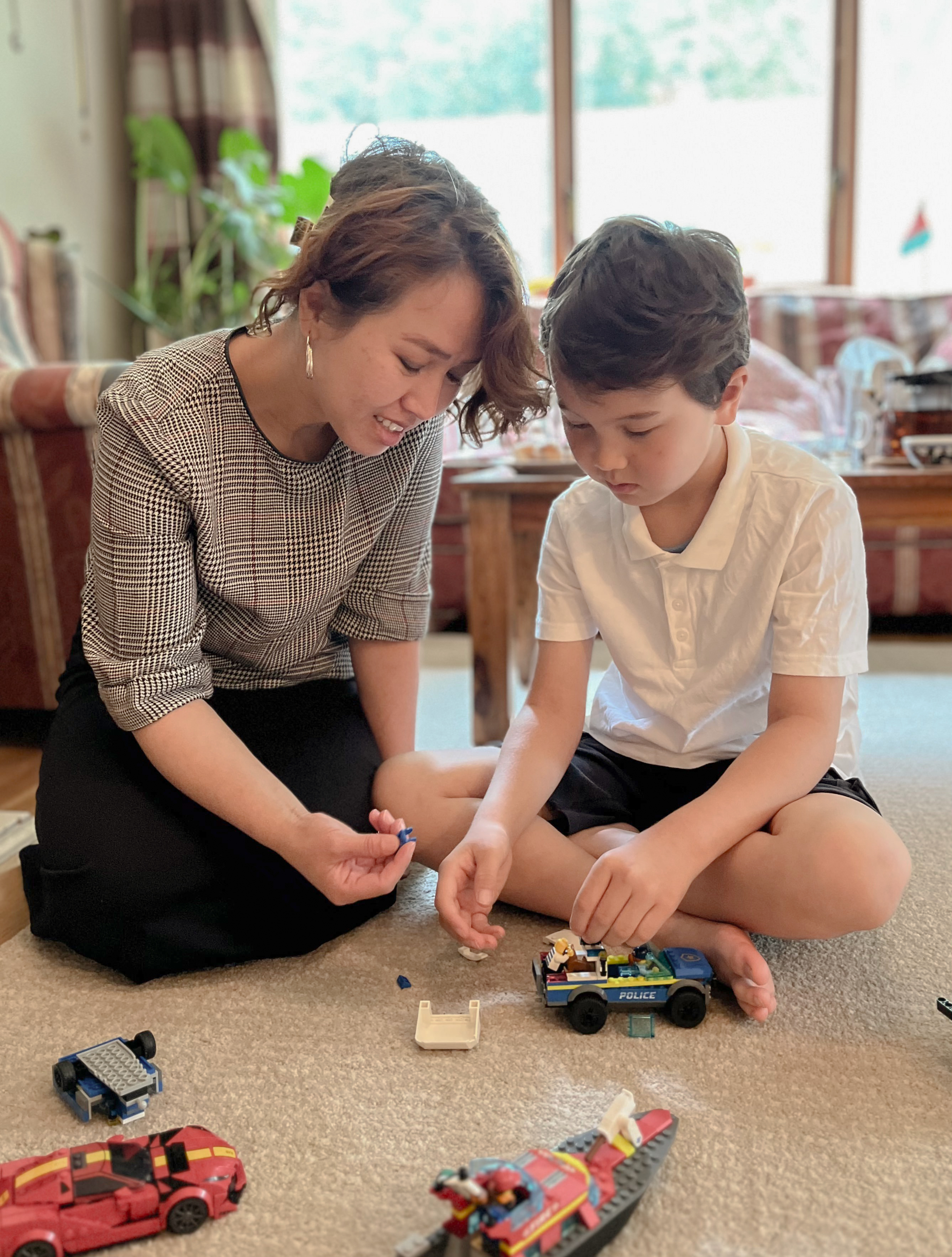 Mother and son playing at their house